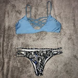 Blue and black strappy swimsuit.